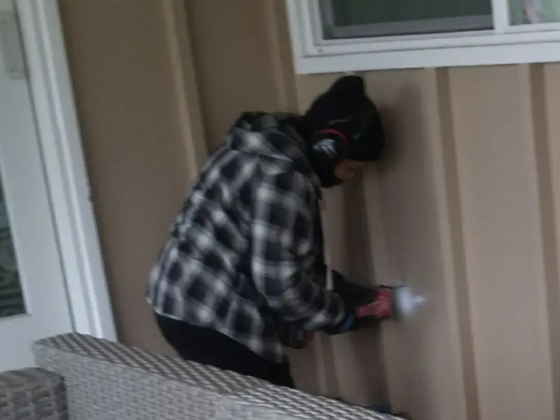 Professional electrician installing an exterior outlet in Beatrice