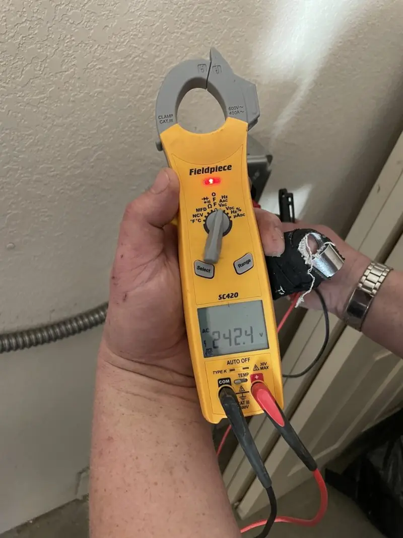 Voltage testing with clamp meter during Generator Installation in Beatrice
